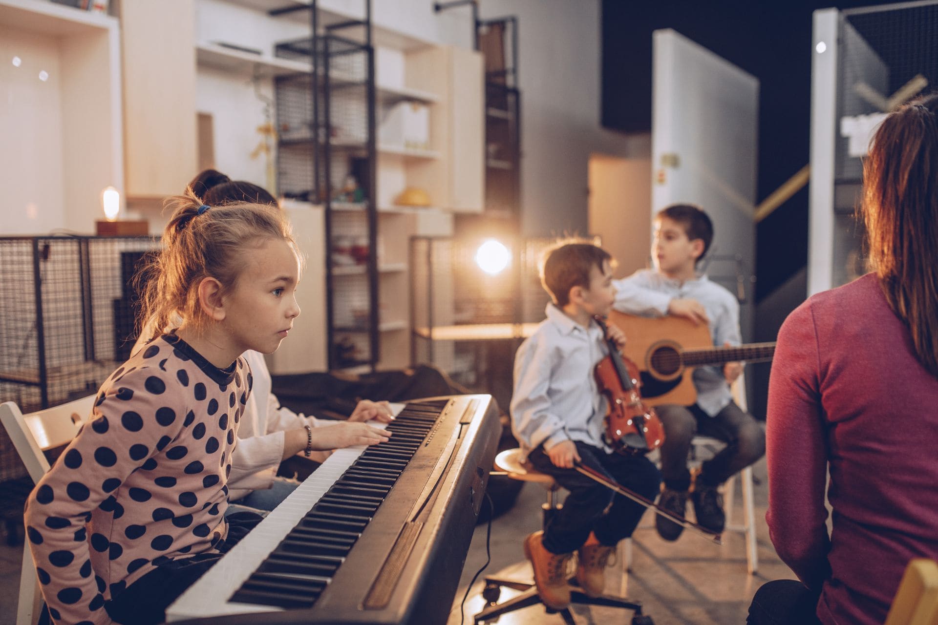students playing music instrument in music class at learn the art