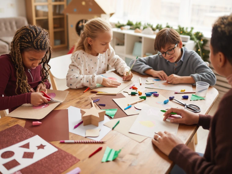 A clean, modern illustration showing a group of diverse students engaged in different art forms—painting, sculpting, acting, dancing, and digital design