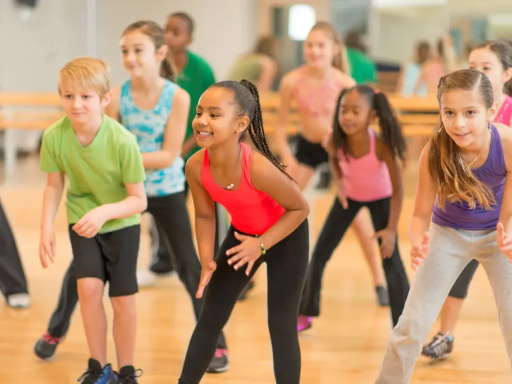 Dancers that are smiling, moving confidently.