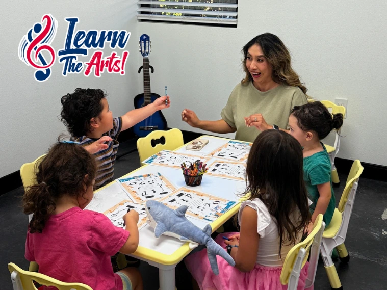 Children participating in engaging art classes at Learn the Arts, painting and drawing in a bright, creative classroom environment