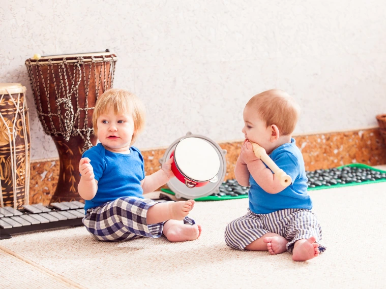 Joyful toddlers participating in a group music class