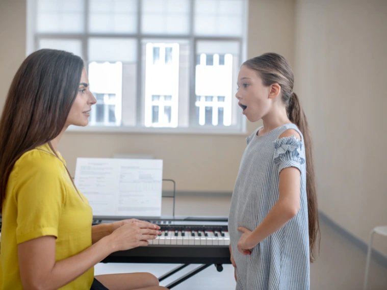 Young singer learning with a vocal coach