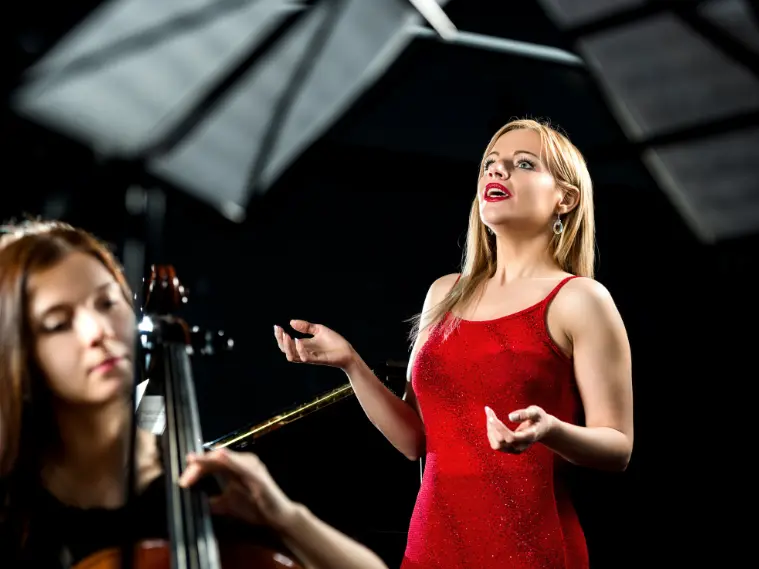 Singer practicing challenging high notes during vocal training