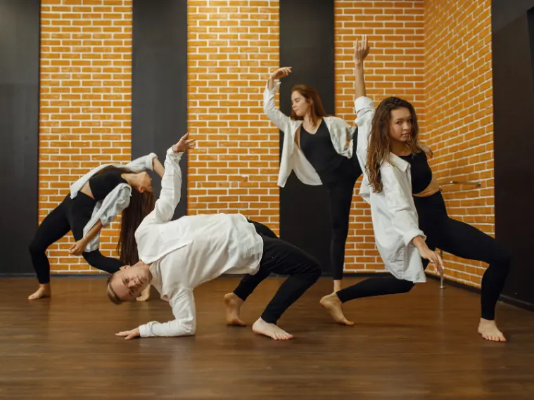 A group of dancers use body language to tell a story through movement