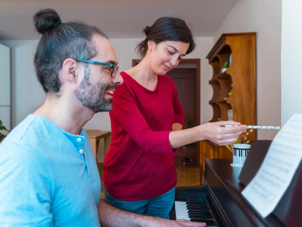Adult beginner taking private piano lesson in a music studio in Arizona with focused one-on-one instruction