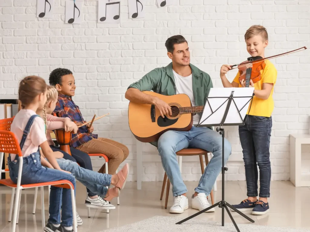 Students learning instruments inside a modern music studio in Las Vegas, Nevada during a music lesson