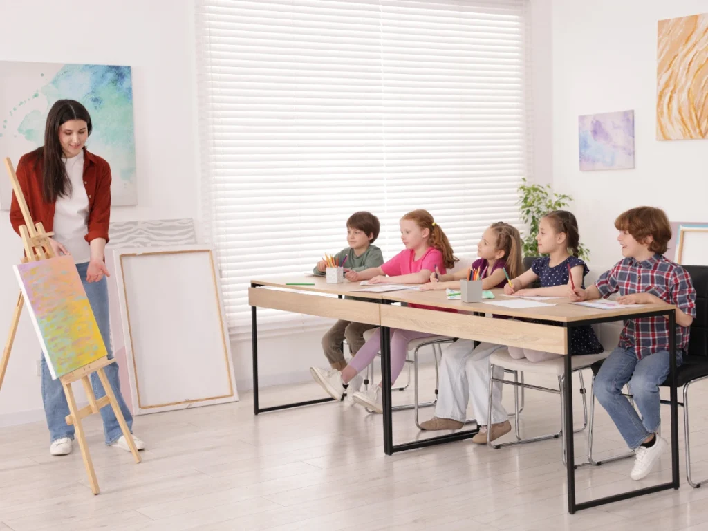 Art instructor guiding kids through hands-on drawing and painting activities in a Westminster, CA art class focused on creativity and skill development
