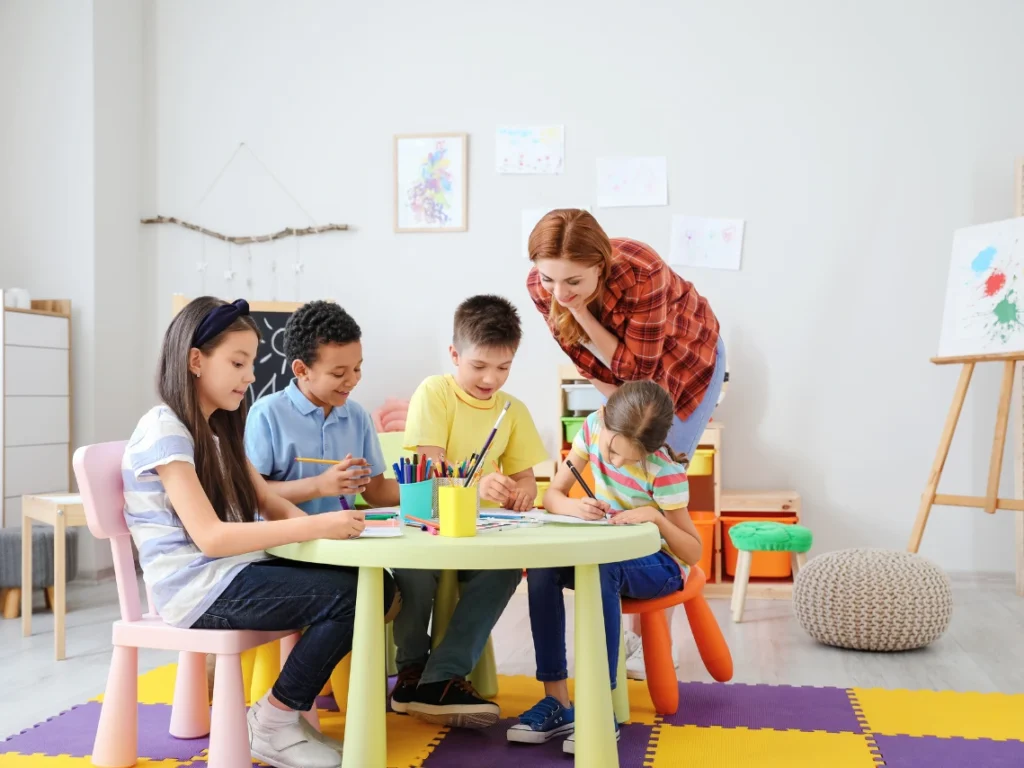 Children participating in fun and creative art classes in Westminster, CA, painting and drawing in a supportive classroom environment
