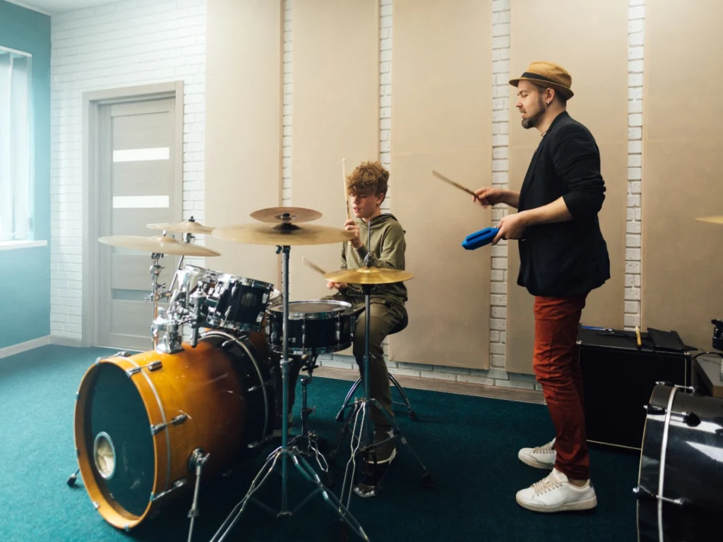 Young drummer practicing rhythm and coordination during a drum lesson in Gilbert Arizona.