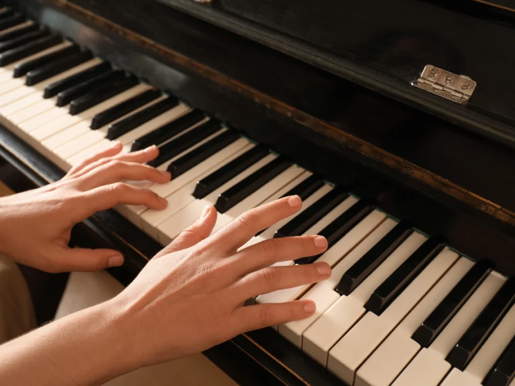 Close-up of pianists hands positioned correctly on piano keys during a lesson in Gilbert, AZ.