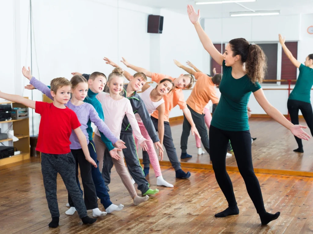 Students learning music and dance together in a professional Westminster, CA academy studio with experienced instructors