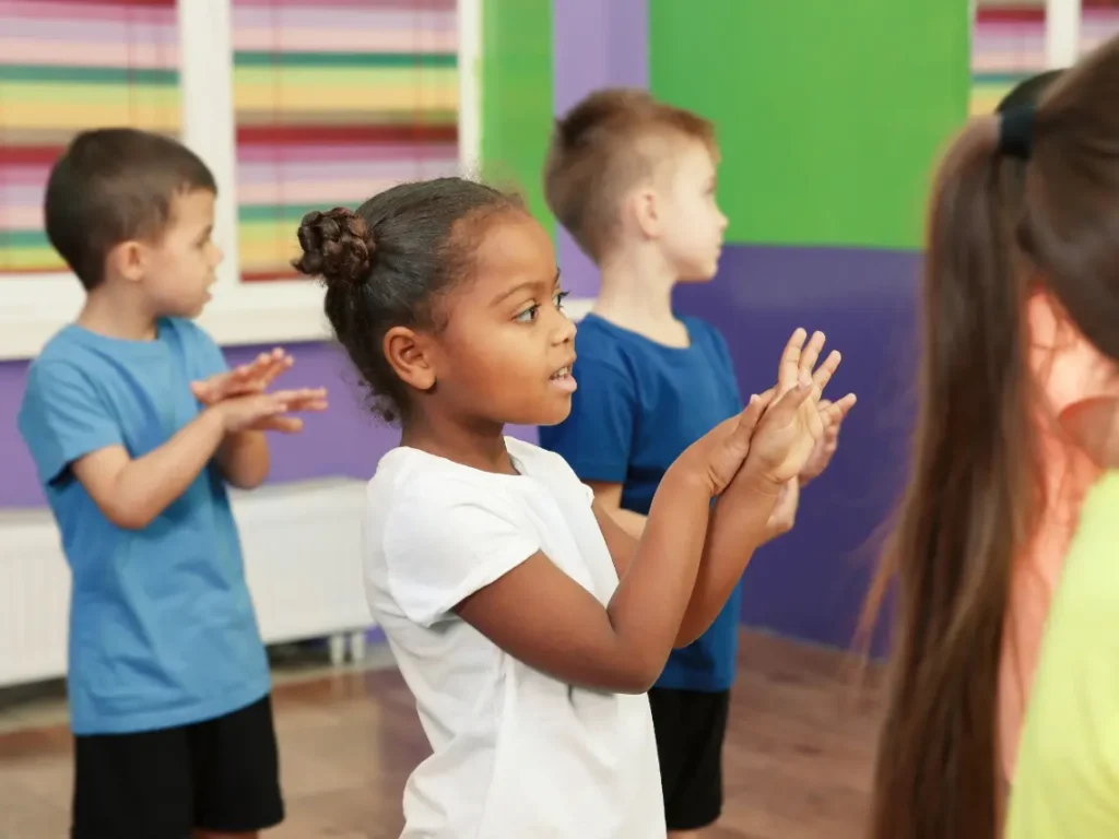 Students learning music instruments and dance in a professional Las Vegas, NV studio setting with qualified instructors.